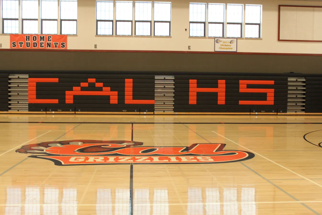 Cal High gymnasium with CAL HS pads and Grizzlies court logo